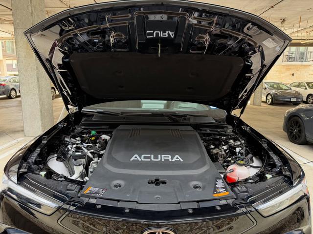 Open hood of the electric Acura ZDX showing the front compartment and cover wiped down and free of dust