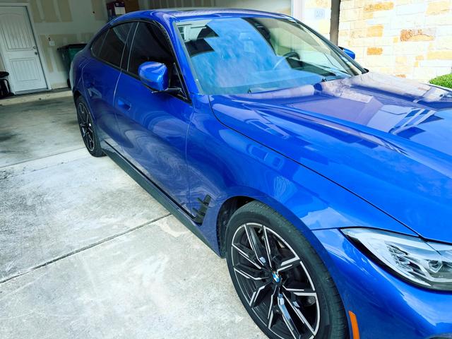 Blue BMW 430i hood and front fender with deep, even gloss after the Gold detail