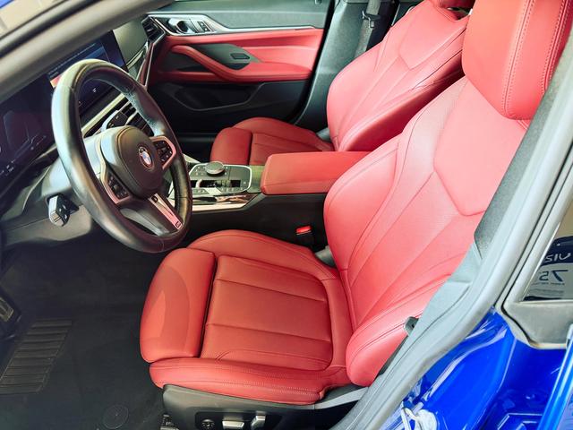 Conditioned red leather front seats inside the BMW 430i after the Gold detail