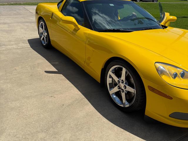 Yellow Corvette front three-quarter view with glossy, reflective paint after the Gold detail