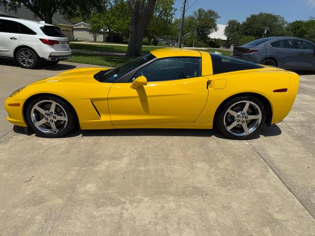 Velocity Yellow 2006 Corvette coupe after a Gold detail, parked with glossy paint and chrome wheels