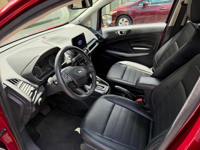 EcoSport cockpit after the detail, with black leather seats, a clean steering wheel, and fresh floor carpet