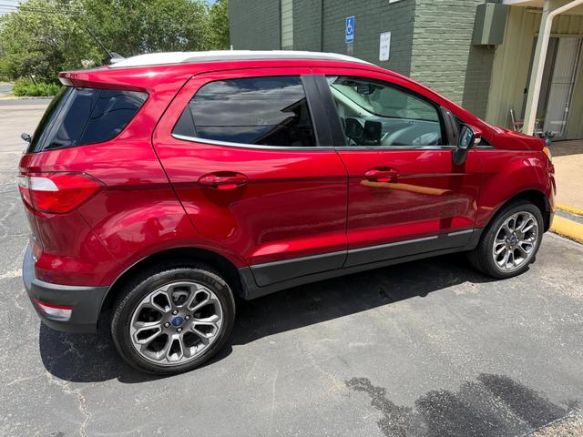 Red Ford EcoSport Titanium after a hand wash, parked with glossy paint and clean alloy wheels