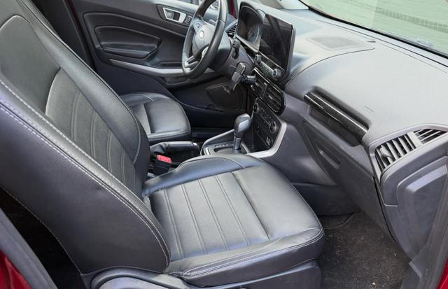 Before: the EcoSport passenger side with pet hair on the carpet and dust across the seat and dash
