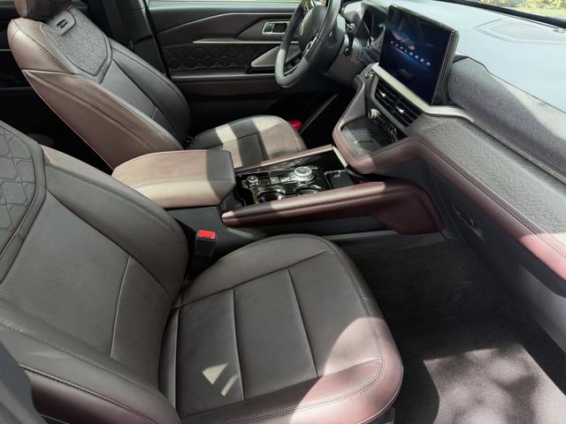 Brown leather passenger seat and console of the Explorer Platinum after a careful interior wipe-down