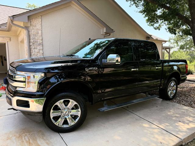 Black Ford F-150 after a Gold mobile detail in Georgetown, with chrome wheels and glossy paint