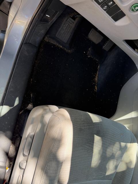 Before: dirty Honda Pilot driver footwell carpet