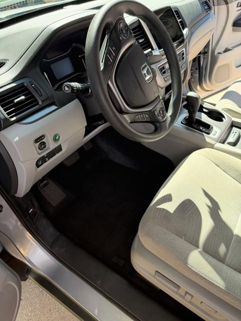 After: clean Honda Pilot driver seat area and floor mat
