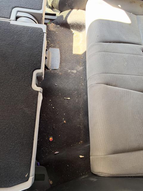 Before: litter across the Honda Pilot third-row floor