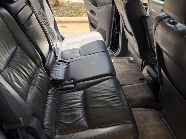 Rear seats of the Lexus GX470 after the detail, with cleaned gray leather and vacuumed carpet