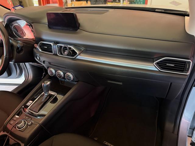 Clean Mazda CX-3 dashboard and center console after glass cleanup