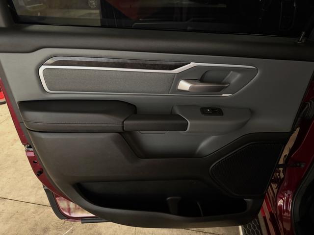 Clean rear door panel on the red Ram 1500