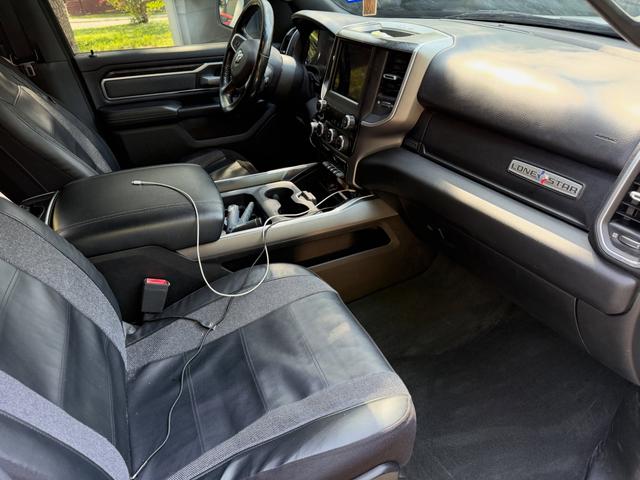 Passenger side dash and seat of the white Ram 1500 after a Silver detail