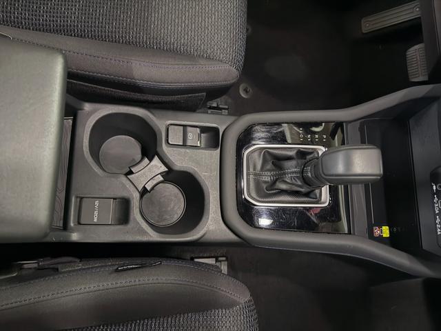 Subaru Forester center console from above after cleaning, with the shifter and cup holders wiped down