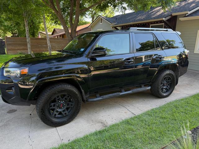 Black Toyota 4Runner after a Silver mobile detail in Austin, parked in a driveway with glossy paint
