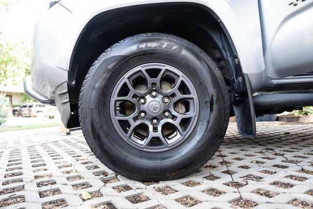 Clean Tacoma alloy wheel with a dressed all-terrain tire
