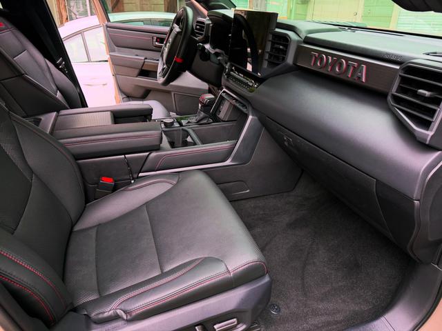 Passenger side of the Tundra cab after the detail, with a clean TOYOTA dash panel, glass, and floor mat